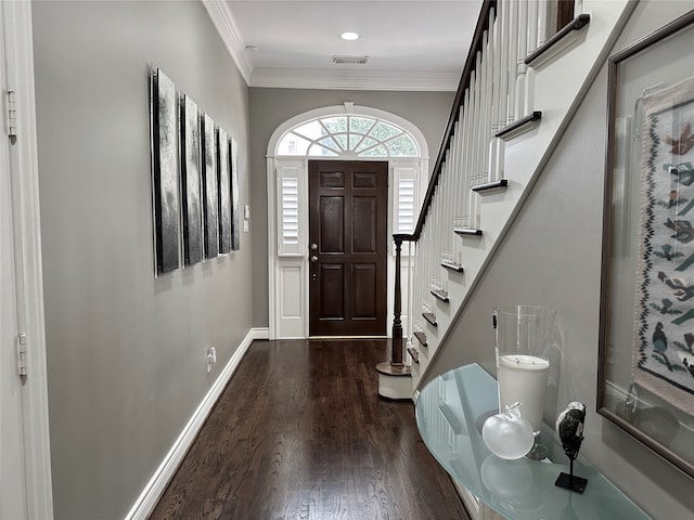 entryway featuring crown molding and hardwood / wood-style floors