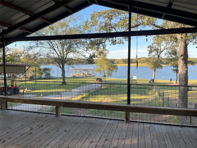 wooden terrace featuring a water view