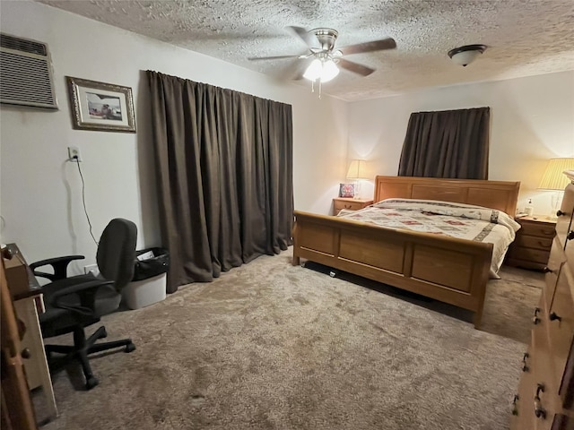 bedroom featuring a wall mounted air conditioner, ceiling fan, light colored carpet, and a textured ceiling