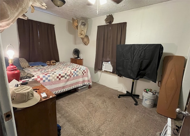 carpeted bedroom with ceiling fan, cooling unit, and a textured ceiling