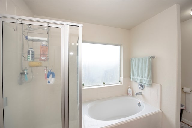 bathroom featuring plus walk in shower