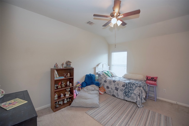 bedroom featuring lofted ceiling, ceiling fan, and light carpet