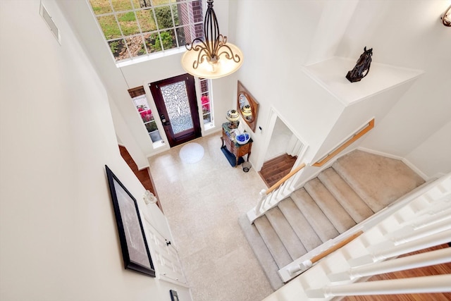 foyer entrance with an inviting chandelier