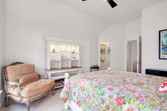 bedroom featuring ensuite bath, ceiling fan, and vaulted ceiling