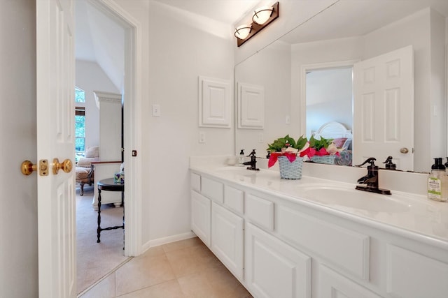 bathroom featuring tile patterned flooring and vanity