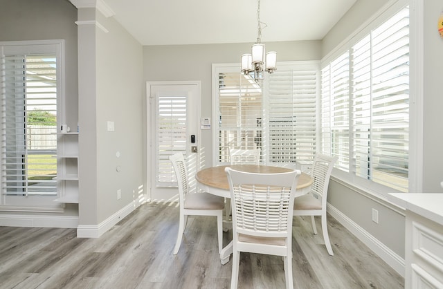 dining room featuring a chandelier and light hardwood / wood-style flooring