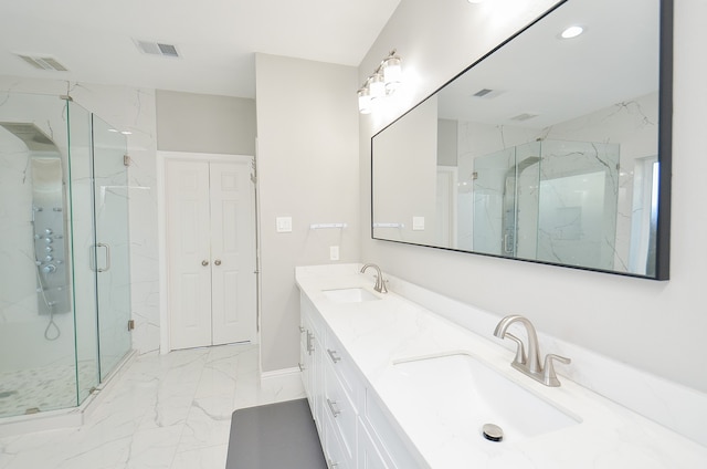 bathroom with walk in shower and vanity