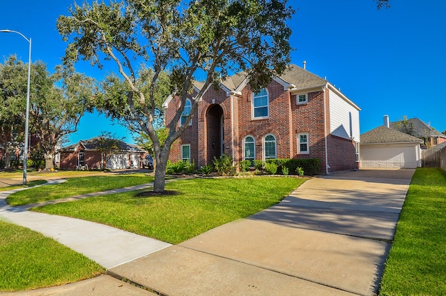 view of front facade featuring a front lawn and a garage