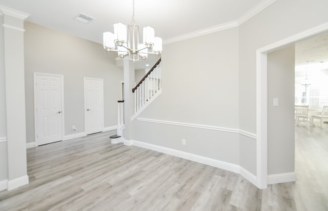 interior space with light wood-type flooring, a notable chandelier, and crown molding