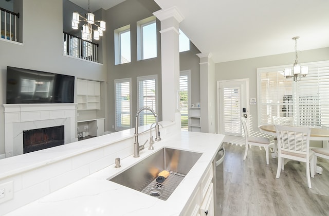 kitchen featuring pendant lighting, a wealth of natural light, and sink