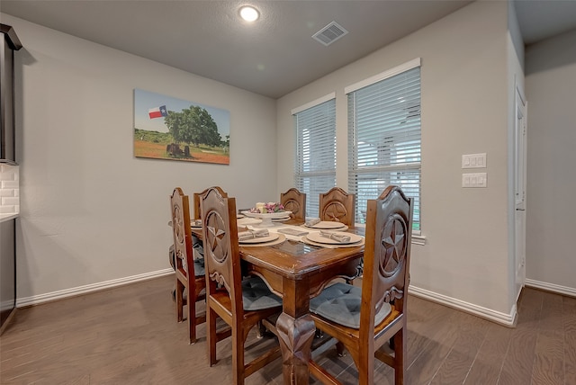 dining area with hardwood / wood-style flooring