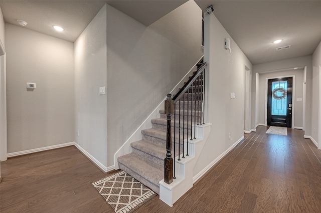 foyer entrance with dark hardwood / wood-style flooring