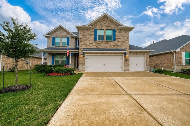 view of front of home featuring a garage and a front lawn