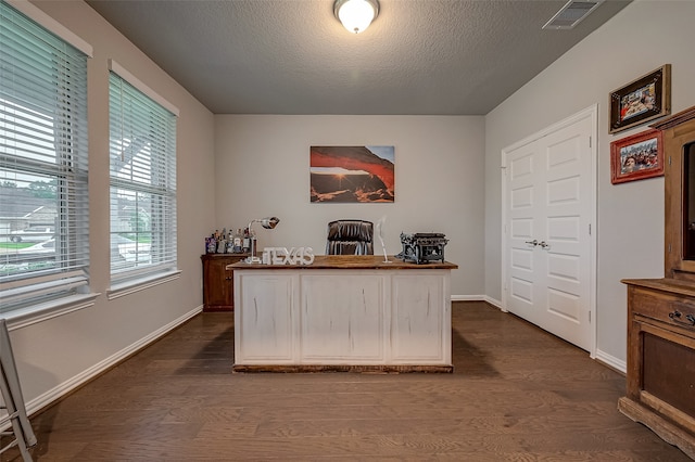 office featuring a textured ceiling and dark hardwood / wood-style floors