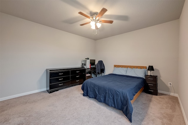 bedroom featuring ceiling fan and light carpet