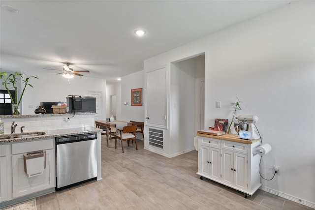 kitchen with dishwasher, light hardwood / wood-style flooring, sink, white cabinets, and ceiling fan