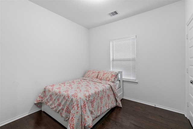 bedroom featuring dark hardwood / wood-style floors