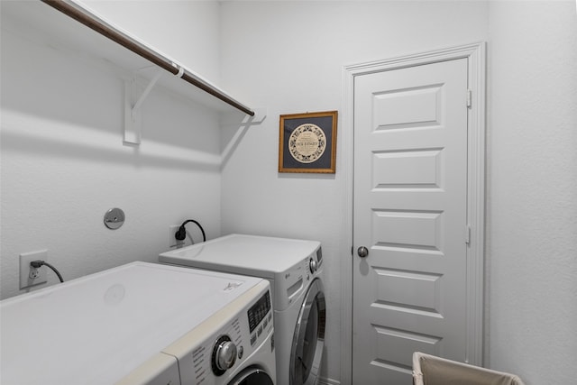 laundry room with separate washer and dryer