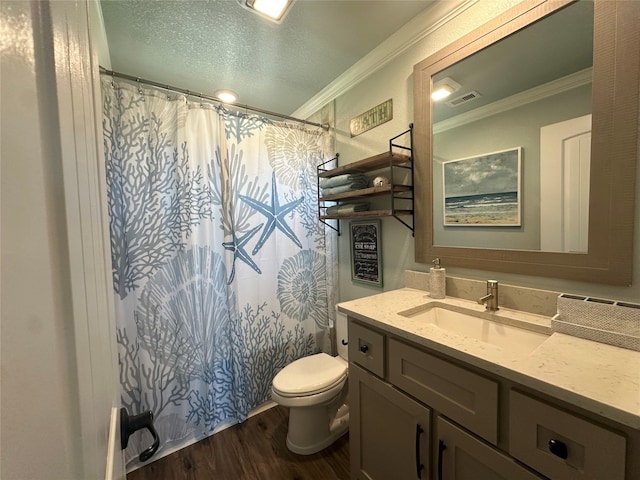 bathroom with wood-type flooring, vanity, toilet, and ornamental molding