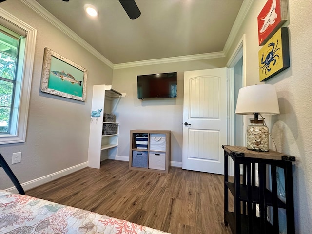 bedroom featuring hardwood / wood-style floors, ceiling fan, and ornamental molding