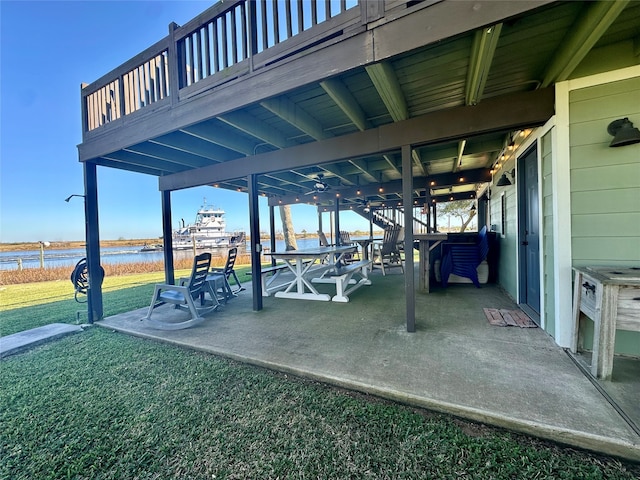 view of patio / terrace featuring a deck with water view