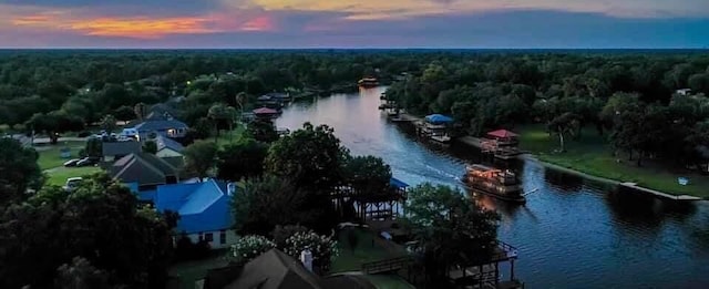 aerial view at dusk with a water view