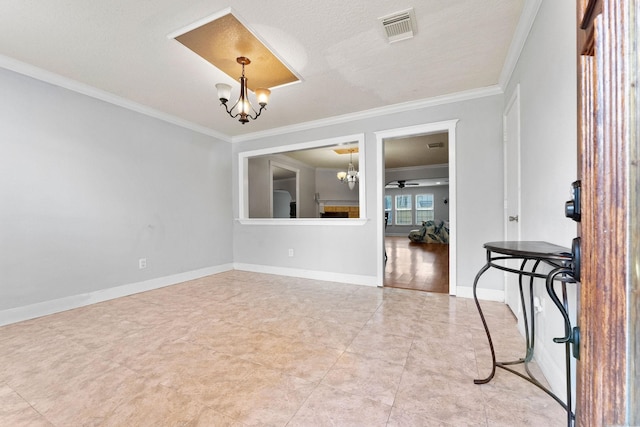 empty room with ceiling fan with notable chandelier, a textured ceiling, and crown molding