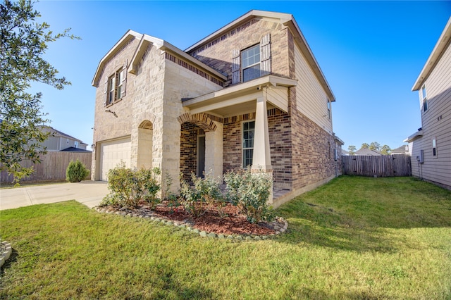 view of front of house with a front yard and a garage