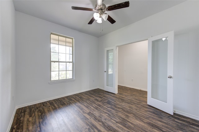 unfurnished room featuring french doors, dark hardwood / wood-style floors, and ceiling fan