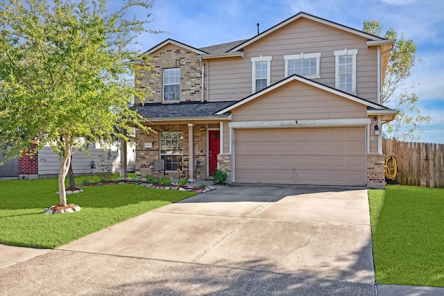 view of front facade featuring a front yard and a garage