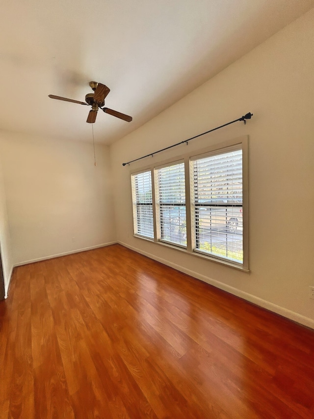 unfurnished room with hardwood / wood-style flooring and ceiling fan