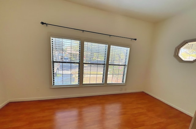 spare room featuring hardwood / wood-style flooring