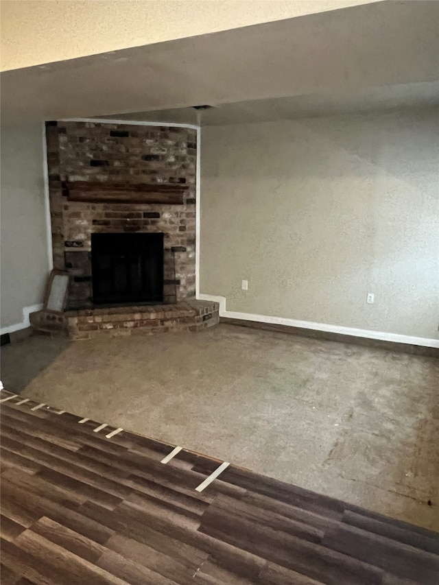 unfurnished living room with hardwood / wood-style floors and a fireplace