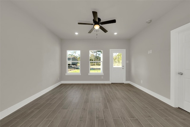 unfurnished room featuring dark hardwood / wood-style floors and ceiling fan