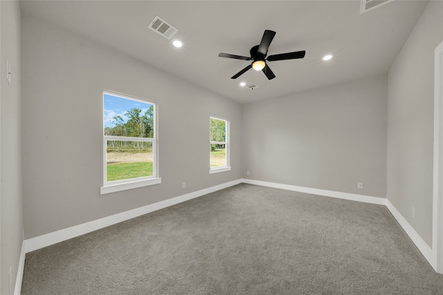 empty room with carpet flooring and ceiling fan