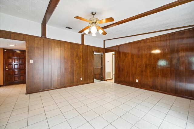 1631 Gault Rd, Houston, TX 77039 - empty room with wooden walls, ceiling fan, and visible vents