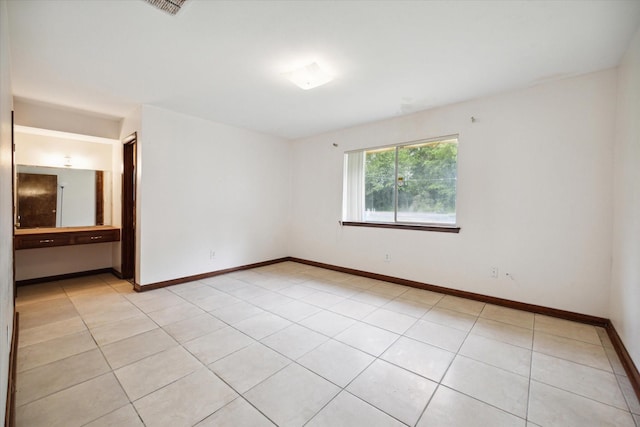 1631 Gault Rd, Houston, TX 77039 - empty room with baseboards, visible vents, and light tile patterned floors