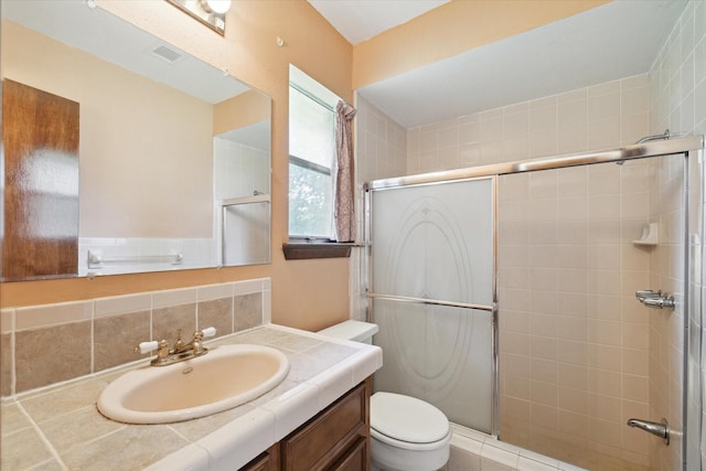 1631 Gault Rd, Houston, TX 77039 - full bathroom with visible vents, a shower stall, toilet, and vanity