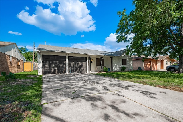 515 Cappamore St, Houston, TX 77013 - single story home featuring an attached garage, driveway, a front lawn, and brick siding