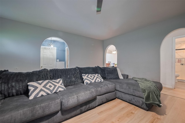 515 Cappamore St, Houston, TX 77013 - living room with arched walkways and wood finished floors