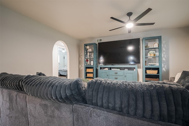 515 Cappamore St, Houston, TX 77013 - living area with a ceiling fan and arched walkways