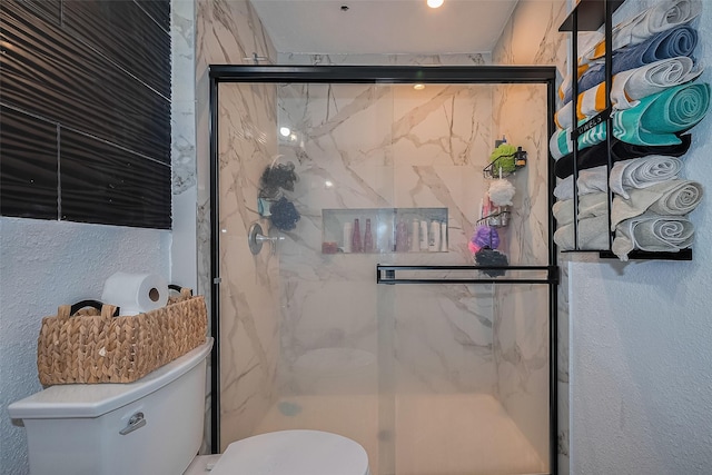 515 Cappamore St, Houston, TX 77013 - full bathroom featuring toilet, a marble finish shower, and a textured wall
