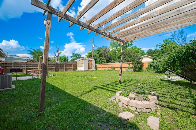 515 Cappamore St, Houston, TX 77013 - view of yard with a storage shed, an outdoor structure, a pergola, and central air condition unit