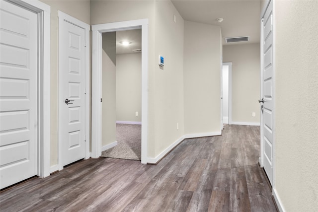 corridor featuring hardwood / wood-style flooring