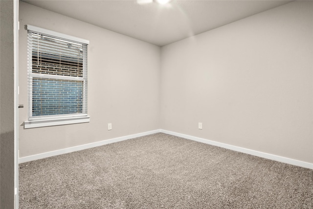 empty room featuring carpet flooring