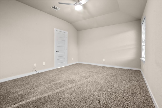 spare room featuring carpet flooring, ceiling fan, and lofted ceiling