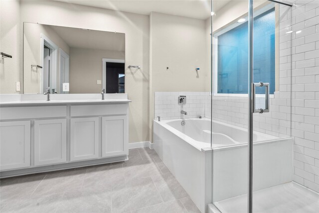 bathroom with tile patterned floors, vanity, and independent shower and bath