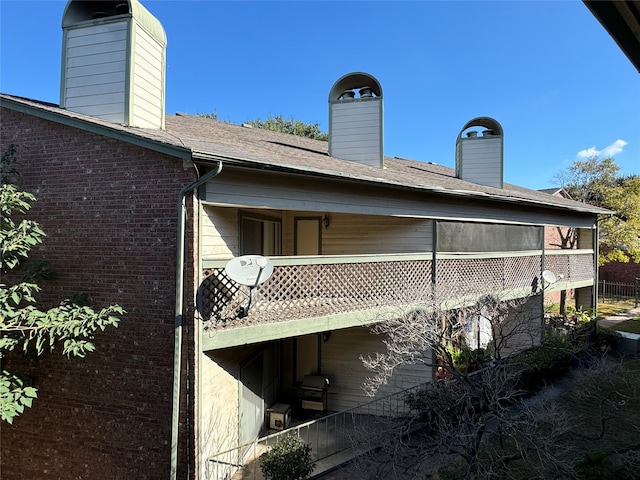 back of house with a balcony