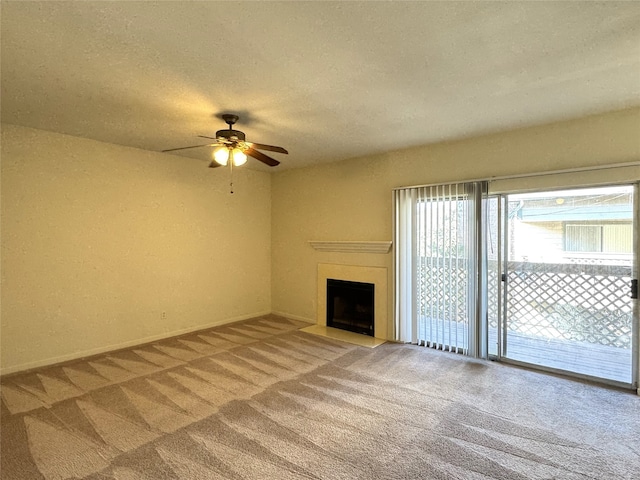 unfurnished living room featuring light carpet, a textured ceiling, and ceiling fan