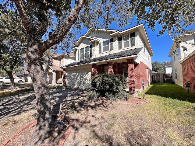 view of front of house featuring a garage and a front lawn